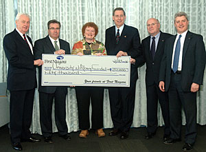 Presenting the check, from left: Daniel J. Hogarty Jr., vice chairman, First Niagara Financial Group; Carl Florio, regional president, First Niagara Bank; Paulette McCormick, director, Gen*NY*Sis Center; UAlbany President Kermit L. Hall; Kevin O'Bryan, senior vice president and chief credit officer, First Niagara Bank; Peter Cosgrove, senior vice president, First Niagara Bank.