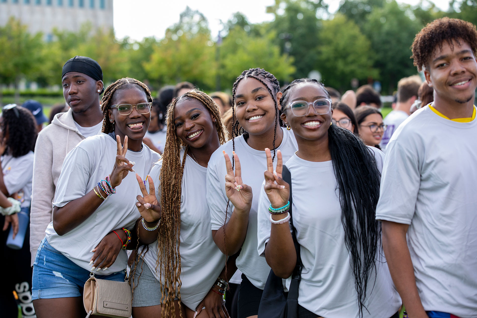 Students posing together outside during convocation.