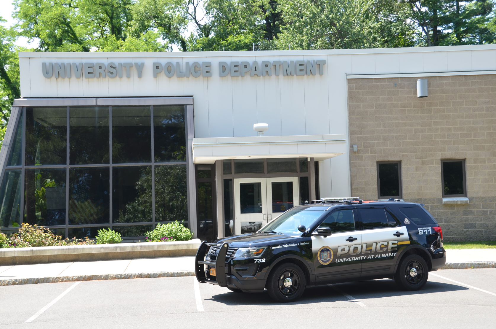 university police department building and patrol cars