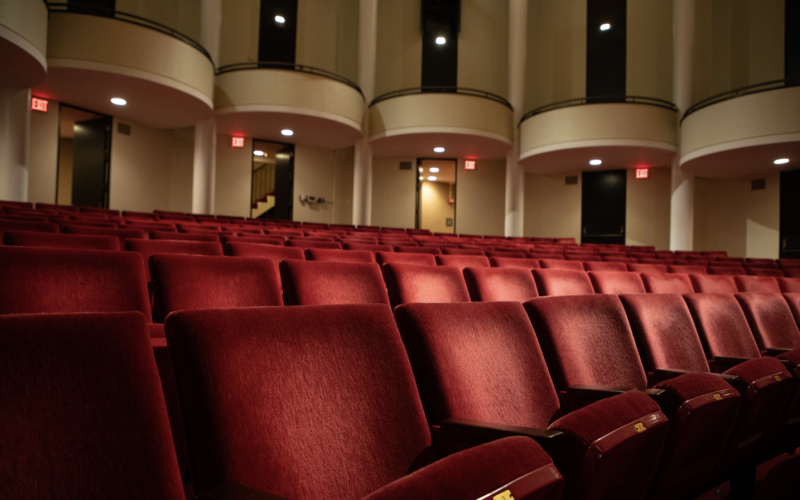 Rows of red velvet theatre seats are pictured inside the UAlbany Performing Arts Center.