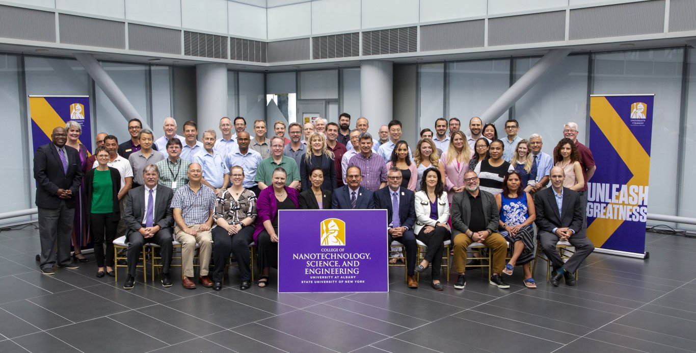 A large group image of the faculty and staff of the College of Nanotechnology, Science, and Engineering.