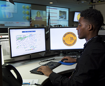 Emergency Operations Center New York UAlbany Student seated at desk