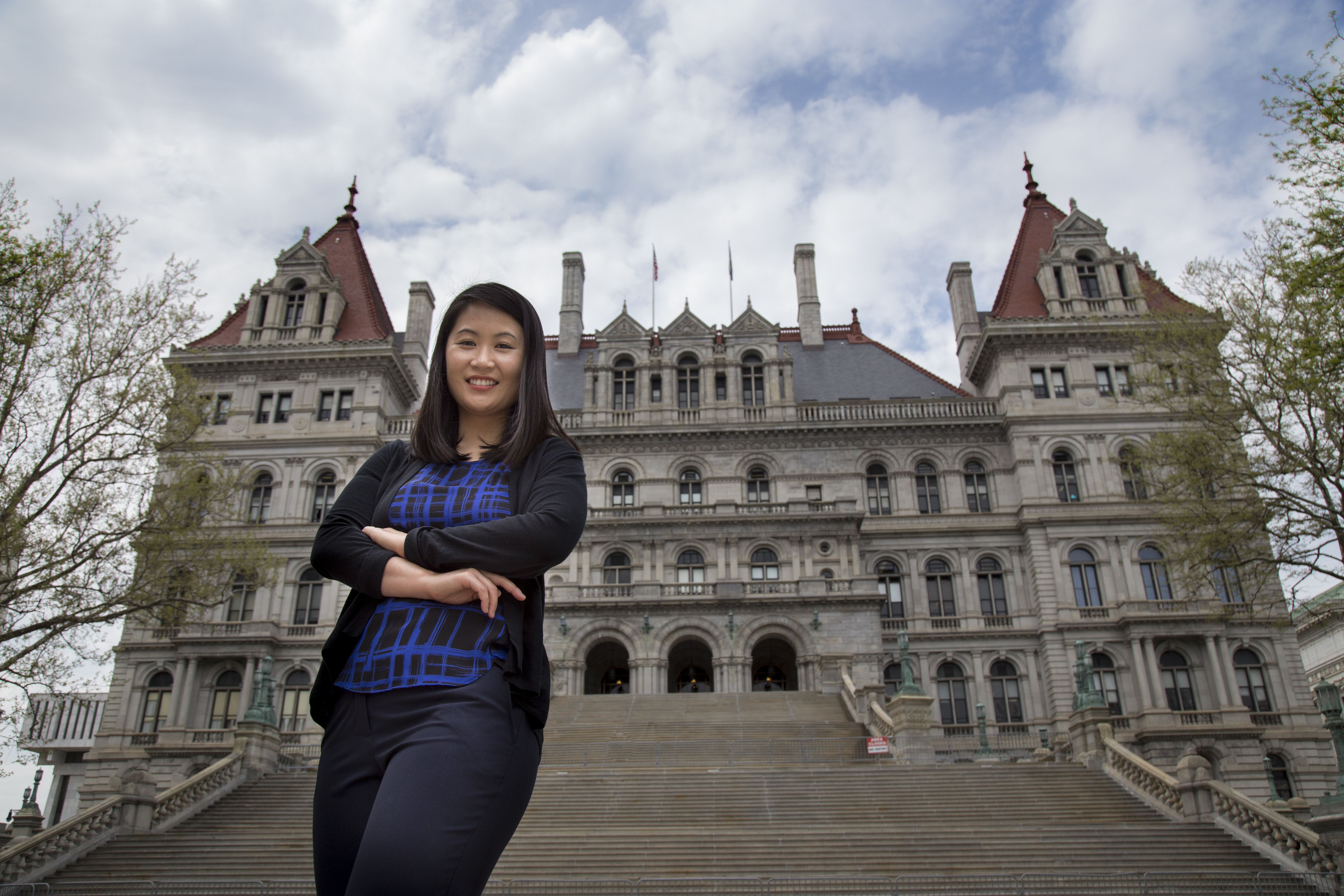 A Rockefeller doctoral student in front of the NYS Capitol.