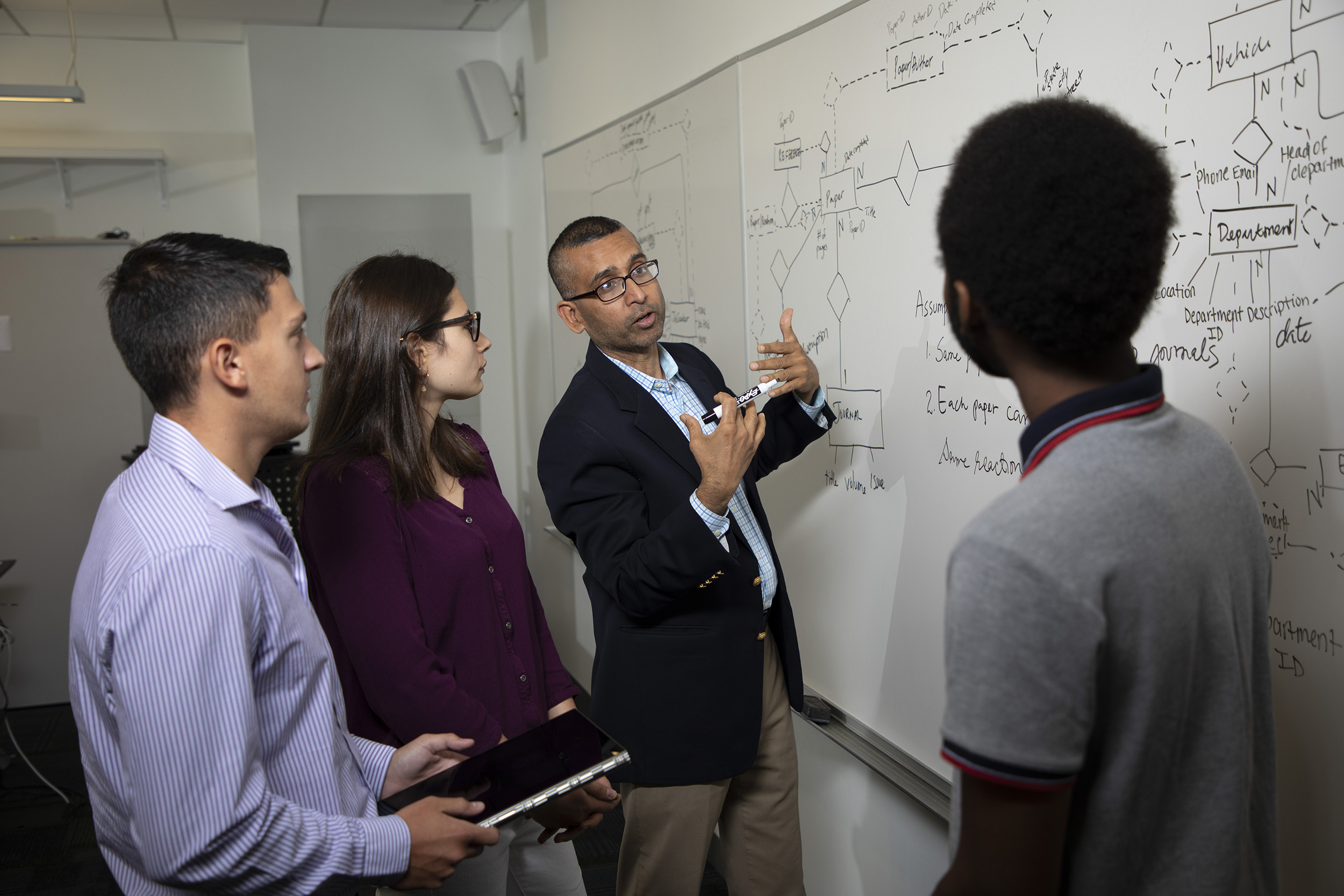 UAlbany Professor Sanjay Goel teaches students in the information forensics lab at UAlbany.