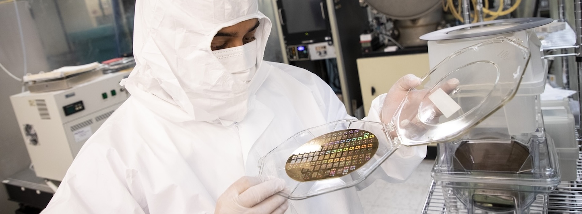 Student examines computer chip at Nanoscale Science and Engineering lab.