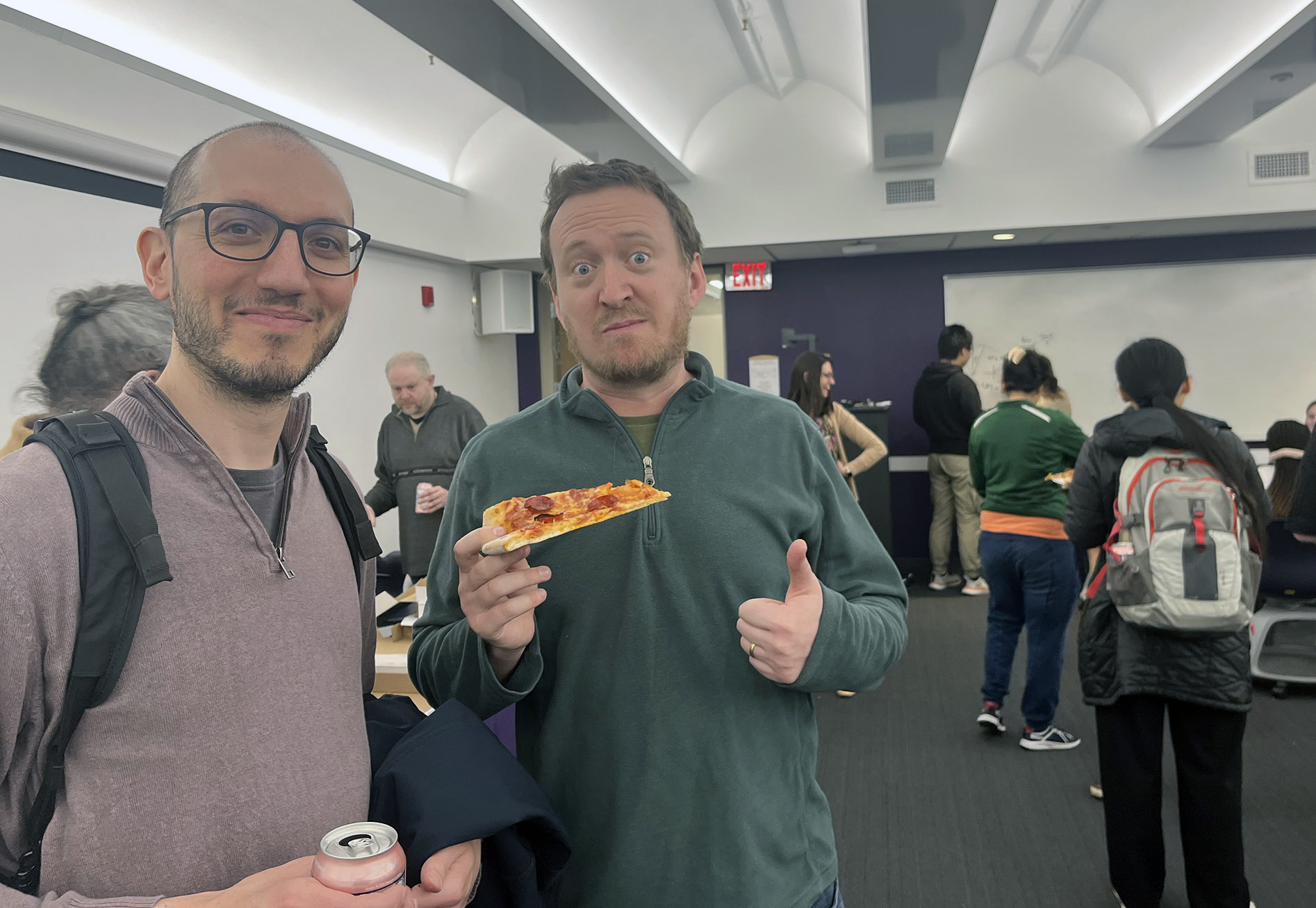 Faculty and staff from UAlbany's Department of Mathematics and Statstics celebrates Pi Day on March 14 with pizza.