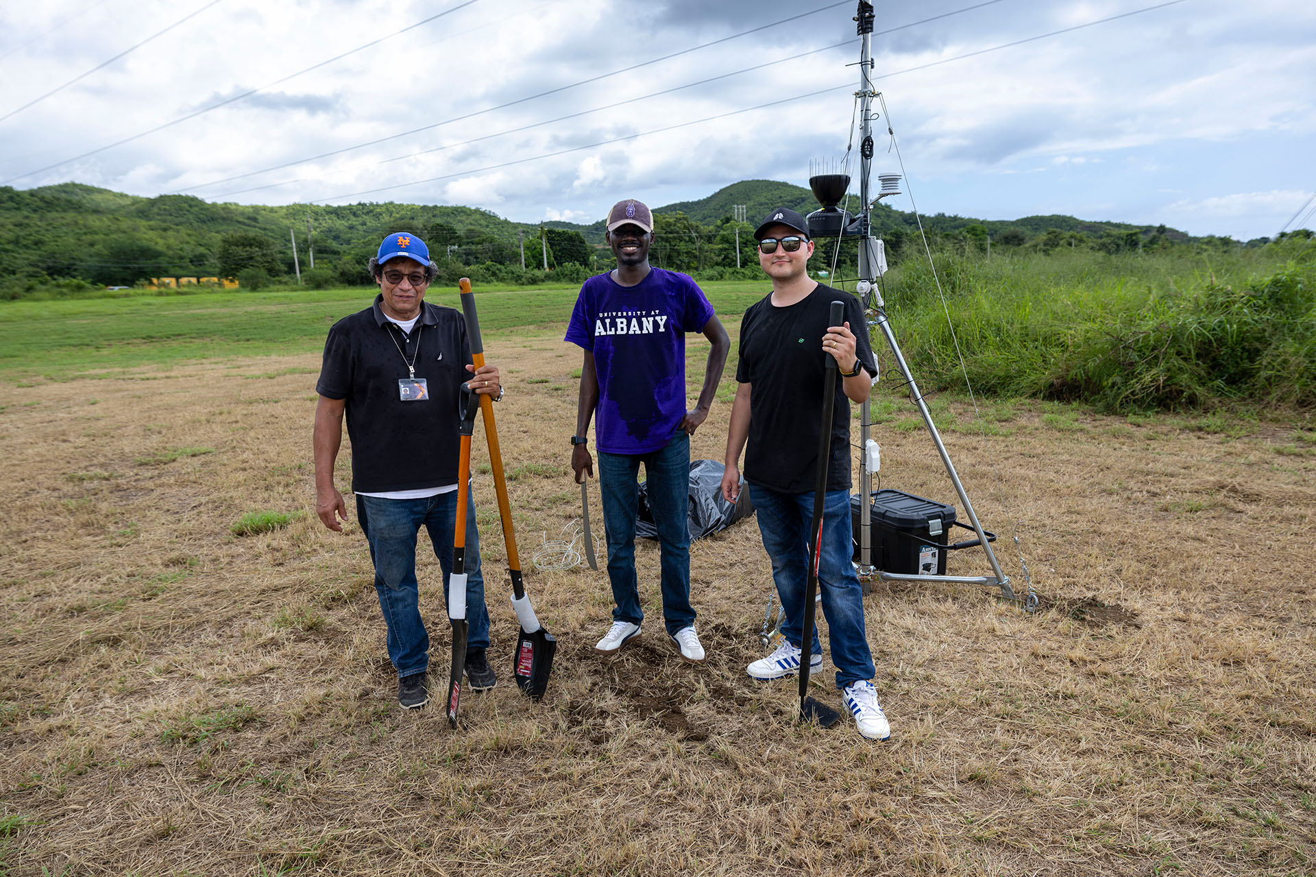 UAlbany researchers stand in front of a specialized sensor installed to monitor Puerto Rico's power grid.