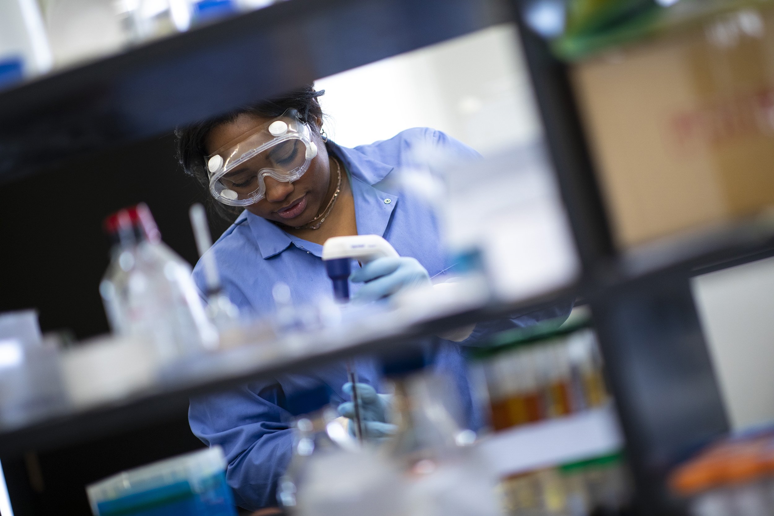 Tamia Wellington works in a lab in the Department of Environmental and Sustainable Engineering at UAlbany.  (Photo by Patrick Dodson)