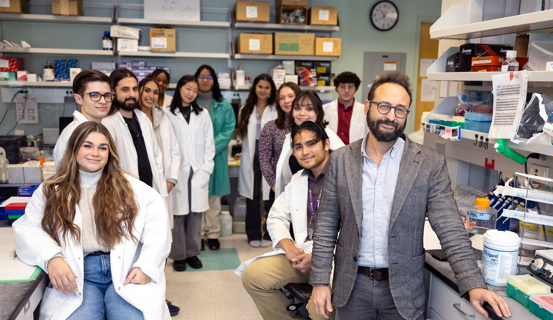 Professor Forni in his lab with his students.