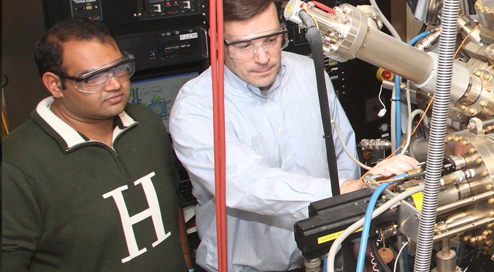 Researchers work on equipment in the Department of Nanoscale Science & Engineering