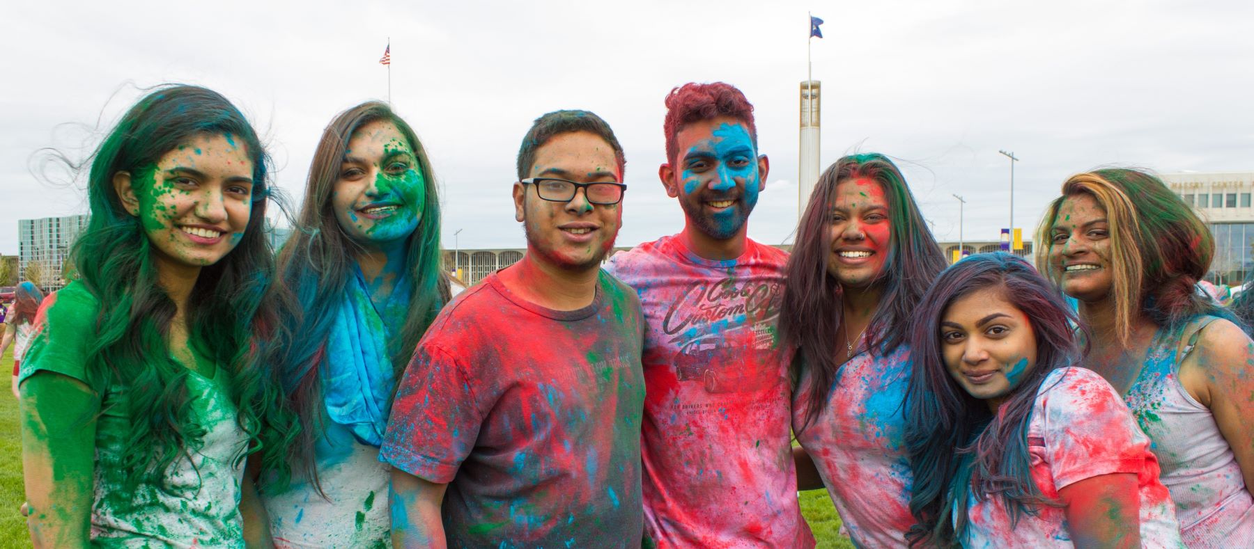 Students pose together on the main campus at a Diwali Celebration.