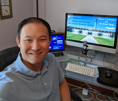 DAES Associate Professor Brian Tang prepares to virtually speak with a classroom of students.