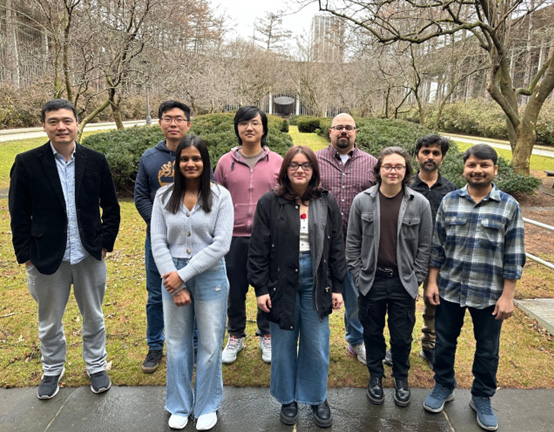 Zhang Research Group Team members with Professor Zhang together in a courtyard on the uptown campus