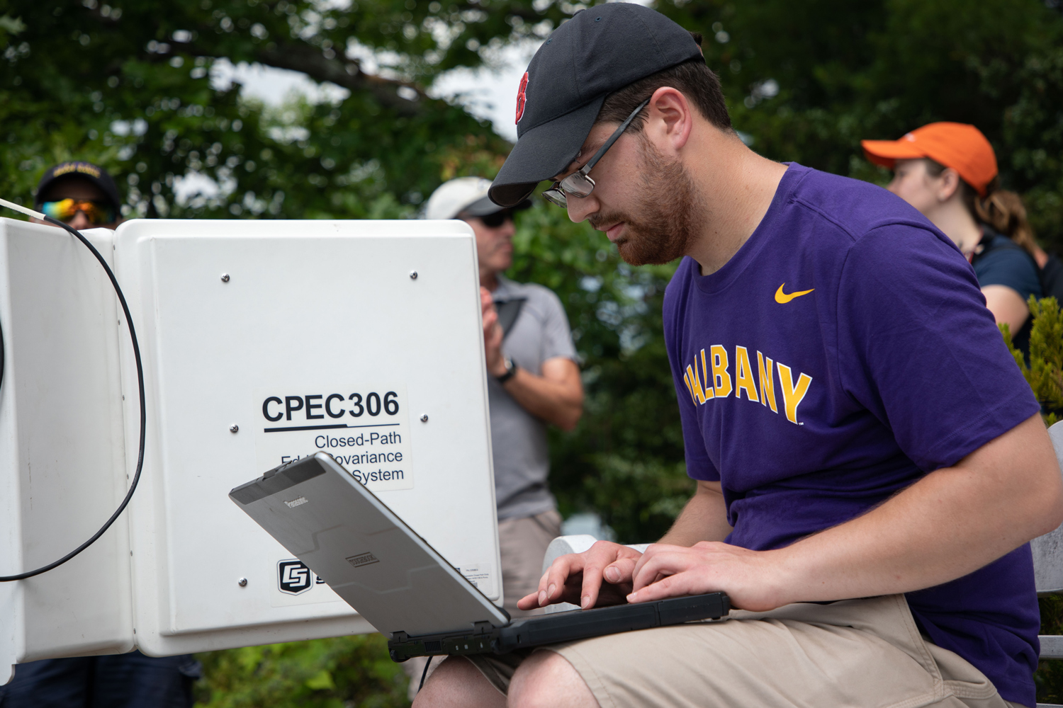A UAlbany student conducting environmental research in the field.