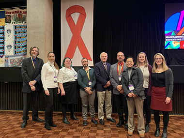 Researchers affiliated with the new Center for Collaborative HIV Research in Practice and Policy, based at the School of Public Health, gathered at the Ending the Epidemic Summit in Albany last year.