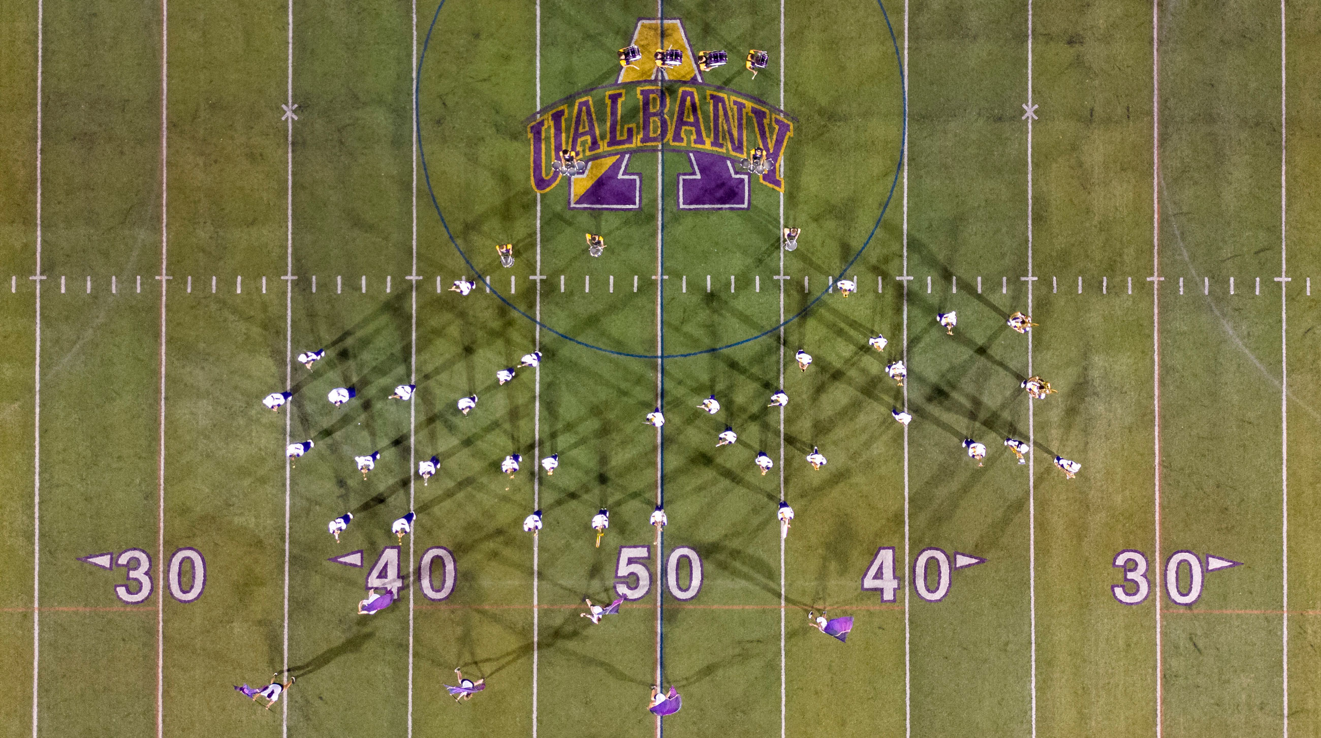 The Marching Great Danes perform on the UAlbany turf, as seen from above from a drone.