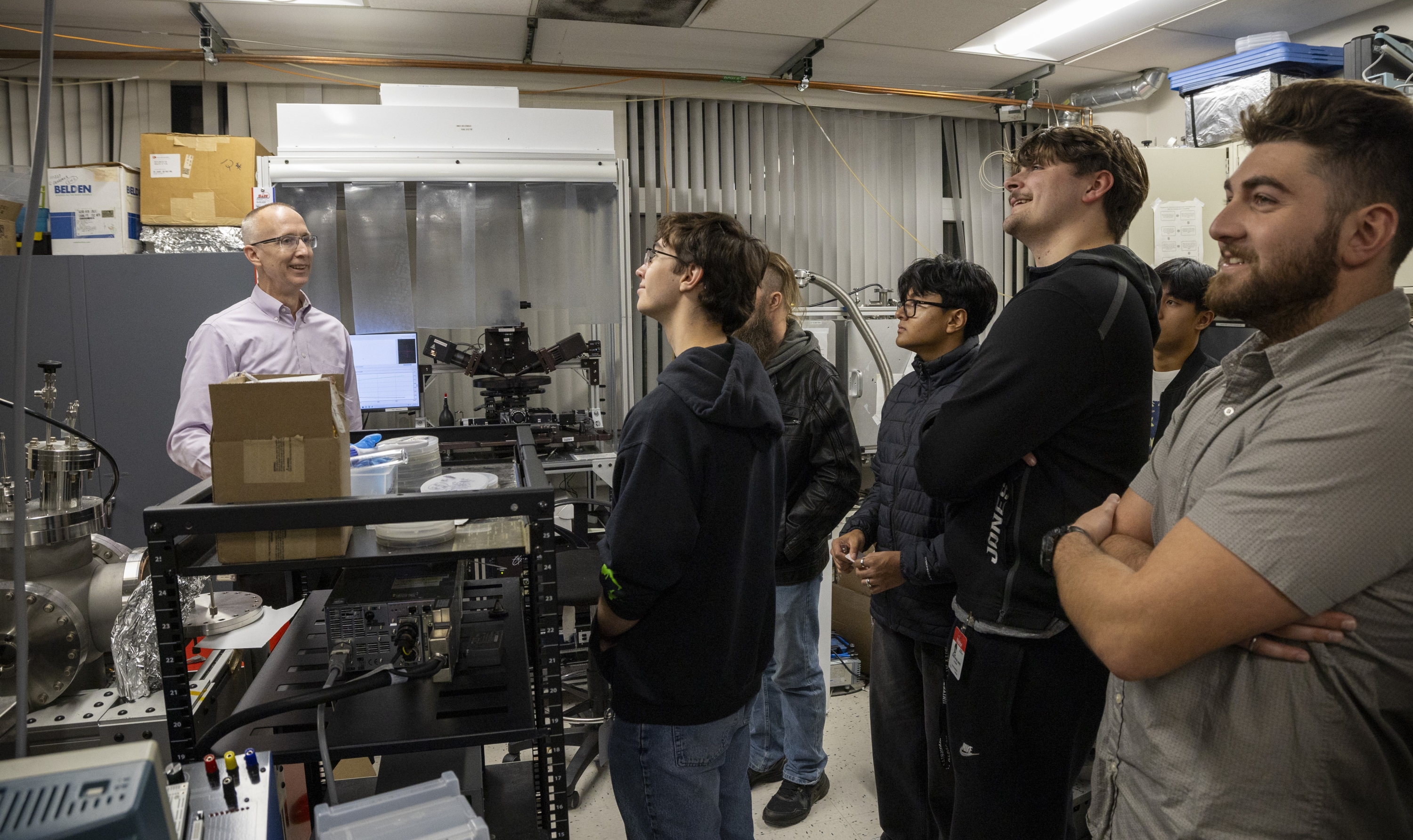 The inaugural class of the Semiconductor and Microelectronics Leadership program at UAlbany tours the lab of Professor Gregory Denbeaux. (Photo by Brian Busher)