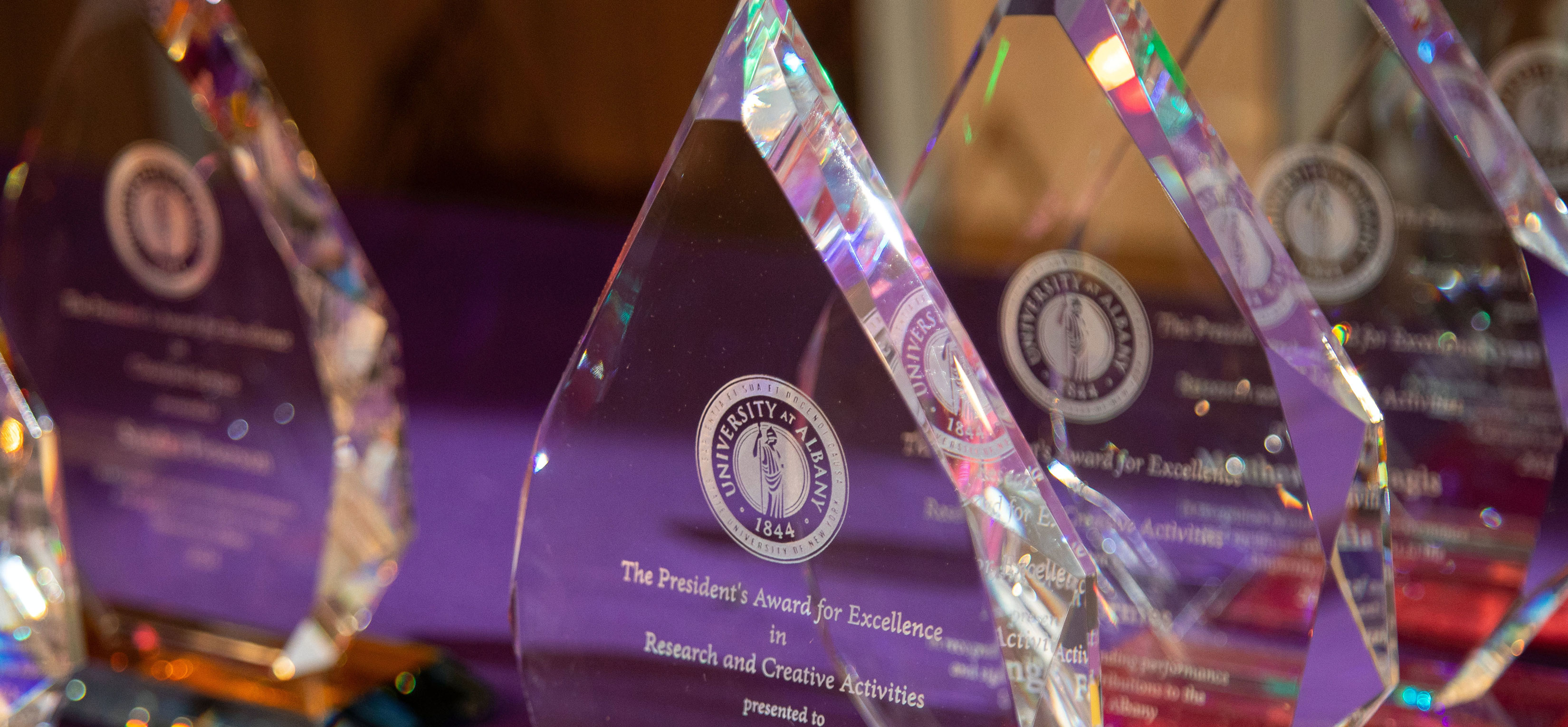 Crystal trophies for the UAlbany President's Awards for Excellence.