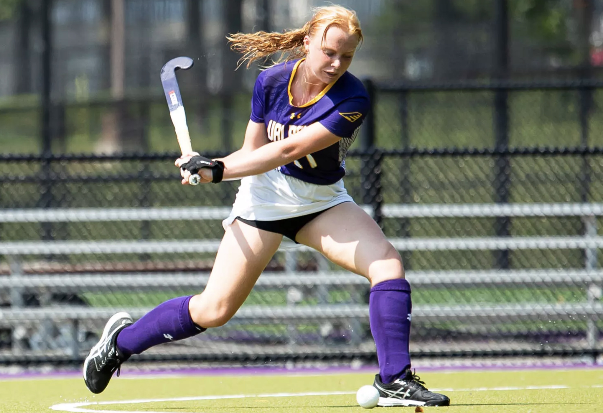 Alison Smisdom of UAlbany field hockey approaches a ball mid swing.