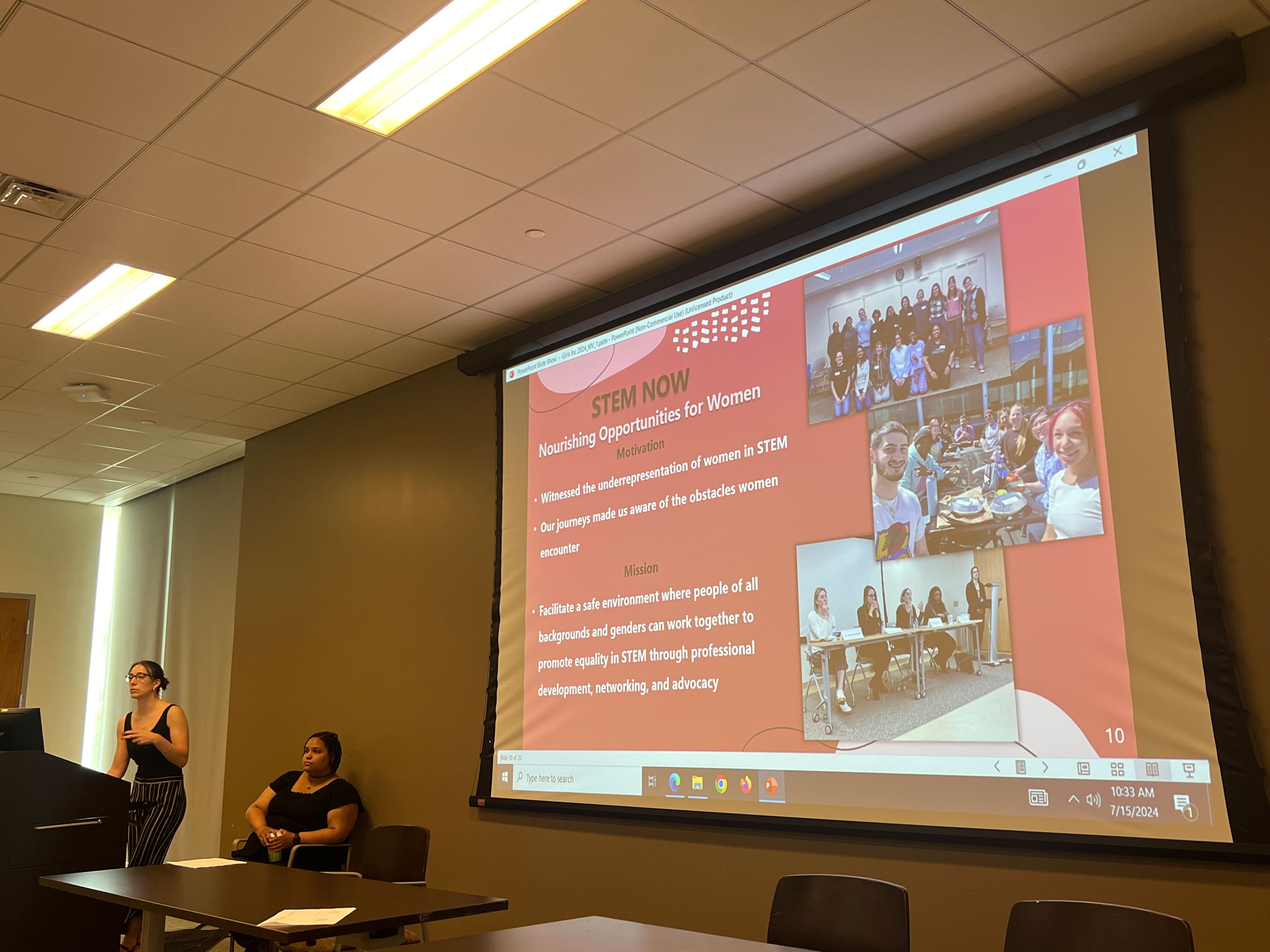 UAlbany alumni Dr. Mónica Ventura, PhD '24,  and Dr. Alexis Weber, PhD '24, present a slide titled "STEM NOW (Nourishing Opportunities for Women)," which lists the motivation and mission of the organization. Read the news story for those details.