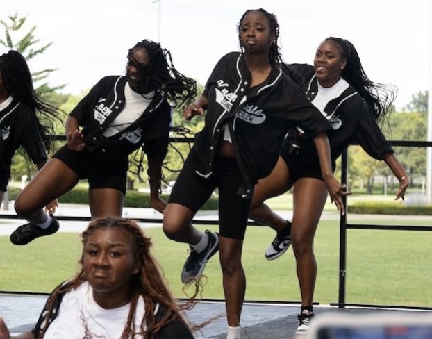 A group of dancers perform.