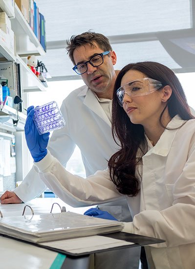 researcher and student in lab