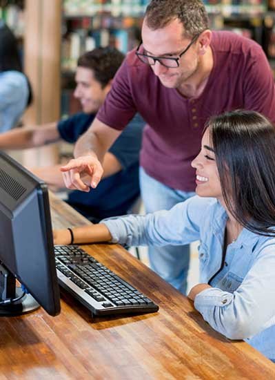 Two students working on a computer