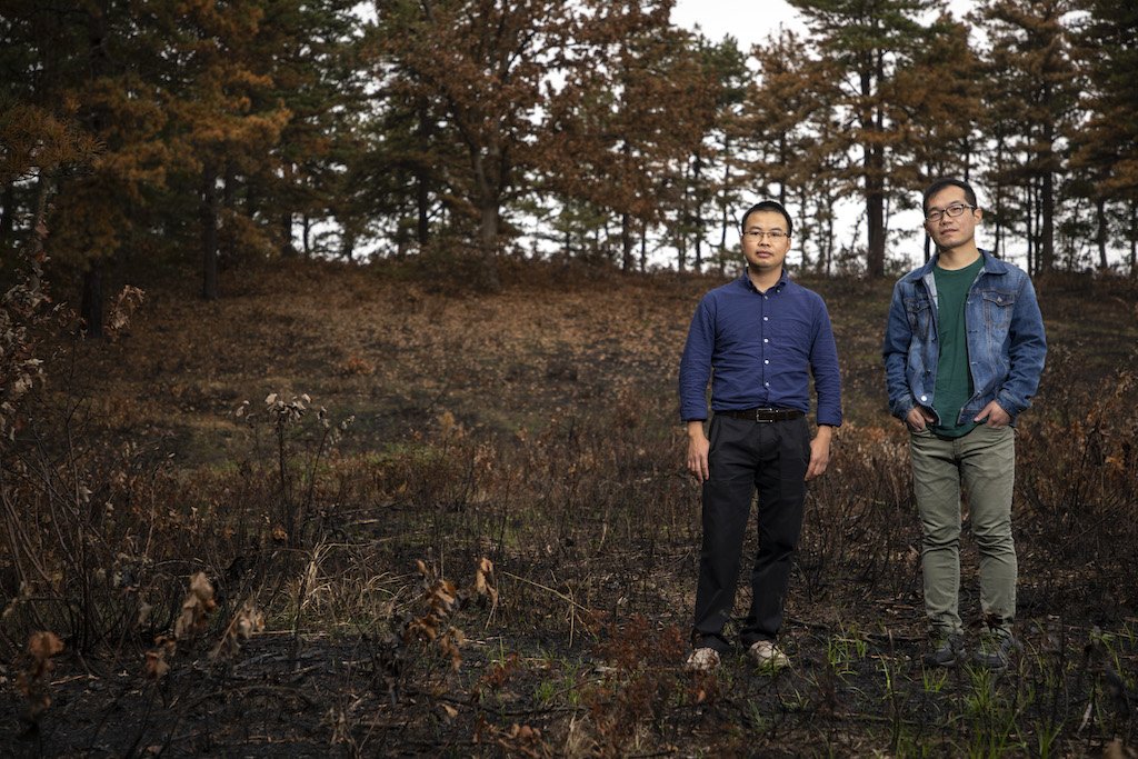 Dr. Rixiang Huang and Lingqun Zeng standing at the Pine Bush Preserve in Albany, New York