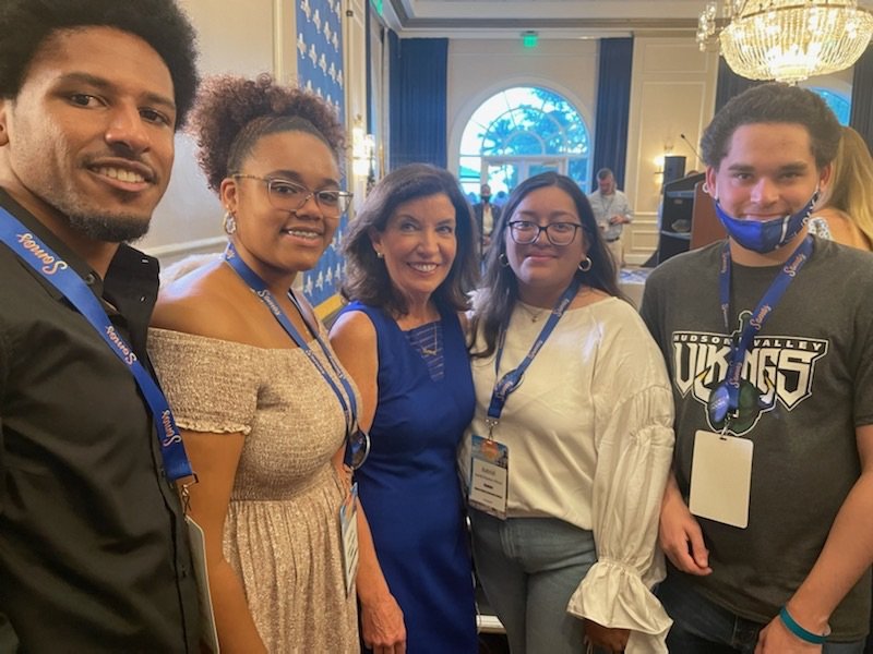  UAlbany EOP students Omahri Sturdivant and Ashlye Reyes, New York State Gov. Kathy Hochul, and HVCC EOP students Astrid Fuentes-Dimas and Stefan Warner pose for a photograph in Puerto Rico.