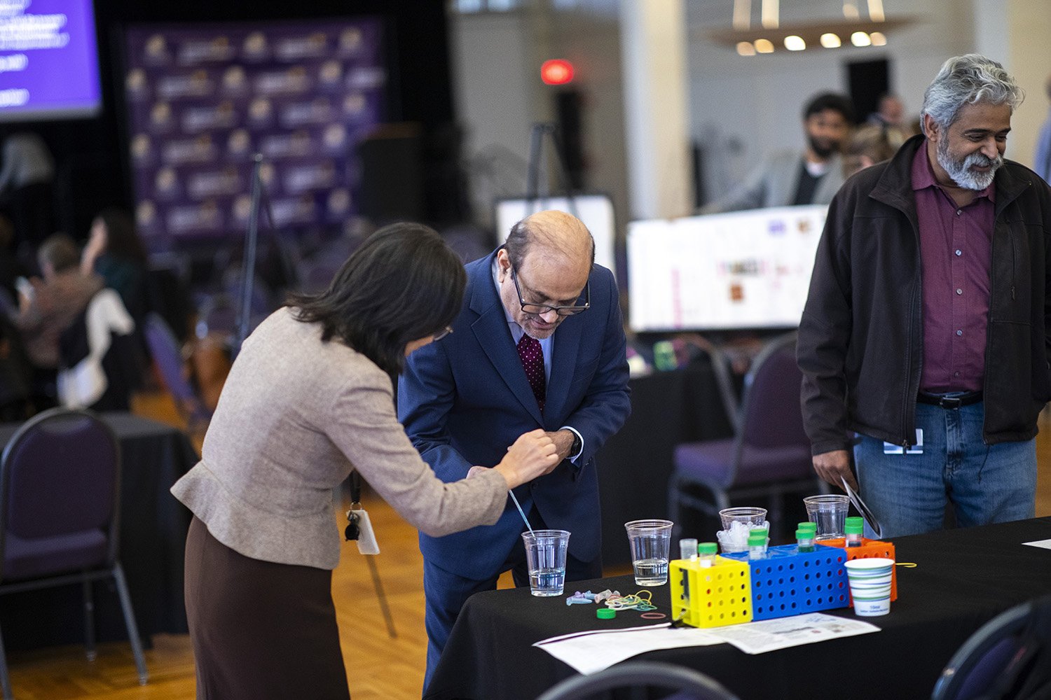 UAlbany Vice President for Research and Economic Development Thenkurussi (Kesh) Kesavadas listens to a presenter at the Research Showcase during R&E Week at UAlbany. (Photo by Patrick Dodson)