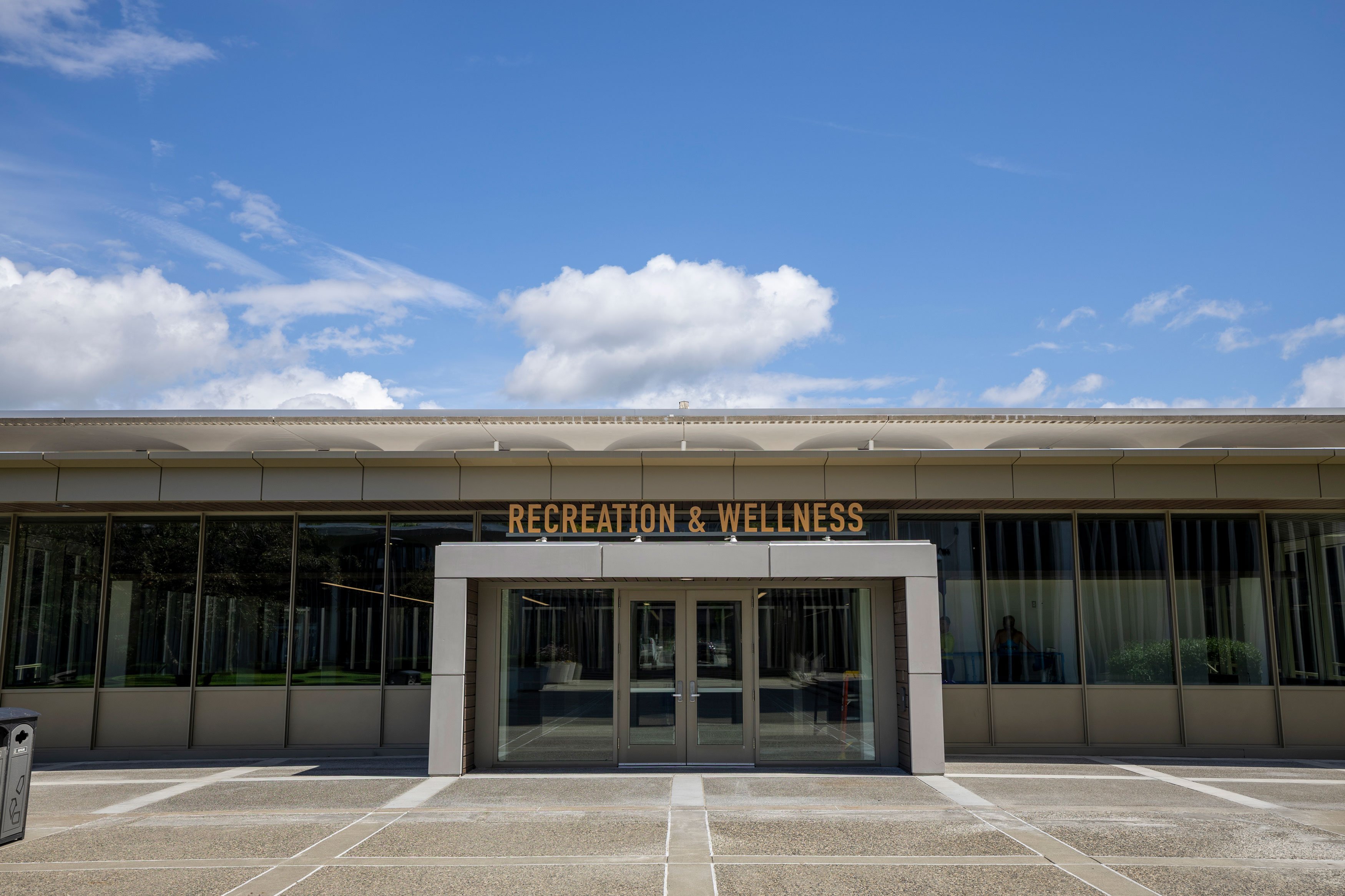 A building entrance with the words Recreation & Wellness above the door.