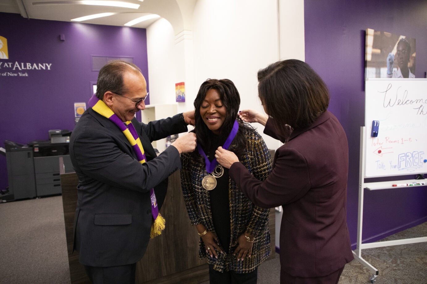 Havidán Rodríguez visiting a University office and laughing with Professor Rabi Musah.