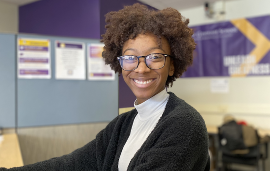 Tychira Brown sitting at a desk.