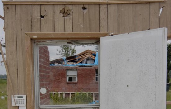 Broken down home showing environmental damage