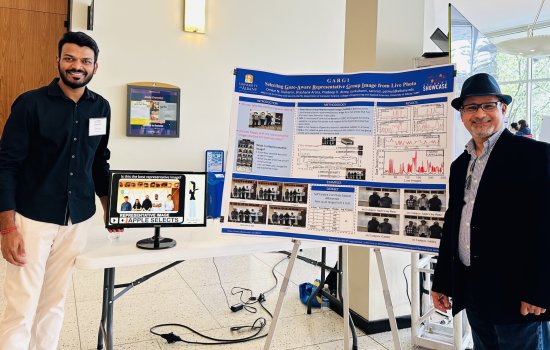 Doctoral student Omkar Kulkarni and UAlbany Associate Professor of Computer Science Pradeep Atrey present their poster for their app 'GARGI', which uses AI to improve group photo images.