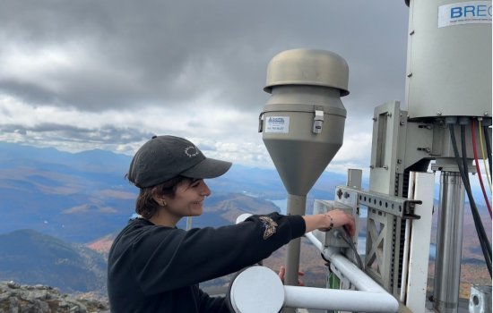 Sara Lombardo configures cloud water instrumentation from the top of Whiteface Mountain.
