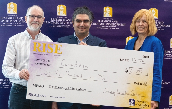 Members of the "current view" team hold a check for 25,000 after winning the annual RISE Demo Day competition at UAlbany.