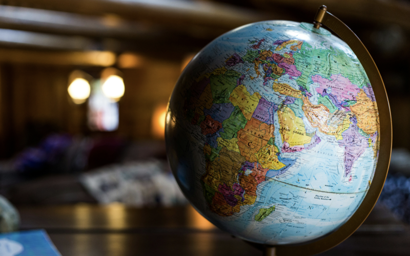 A globe sits on a table with the continents of Africa, Asia and Europe facing the viewer.
