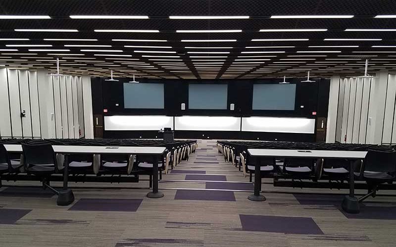 A renovated lecture center from the top of the stairs.