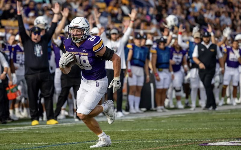 Griffin Woodell, a sophomore running back on the UAlbany football team, heads to the endzone for a touchdown on a long run.