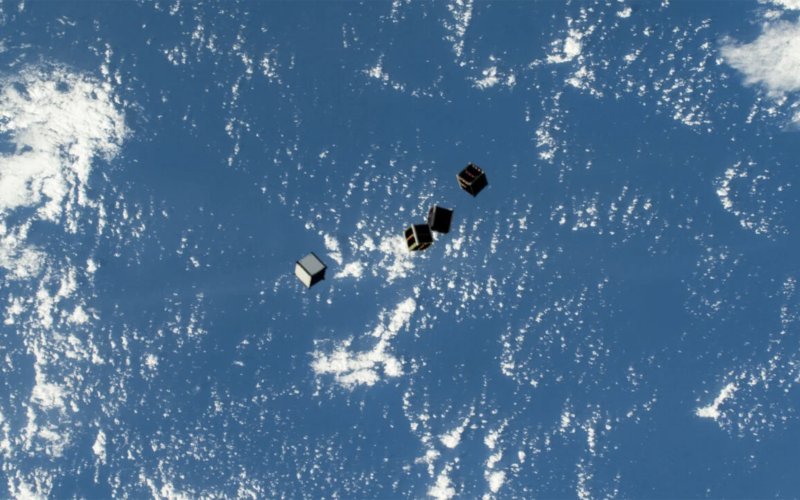 CubeSats, are pictured after being deployed into Earth orbit from a small satellite orbital deployer on the outside of the International Space Station's Kibo laboratory module. (Photo by Tracy Dyson/NASA)