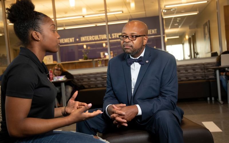 Student Association President Desann Chin-Carty speaks to Dean of Students Clarence McNeill