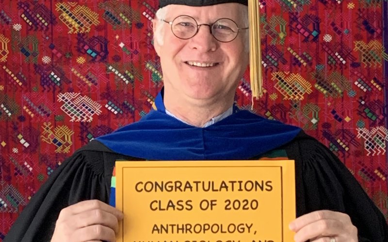 Walter Little holds sign that congratulates class of 2020