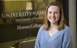 Caitlyn Zon, an Honors student and Truman Scholarship Foundation finalist, stands outside the college's offices in the Lecture Center. (Photos by Patrick Dodson)