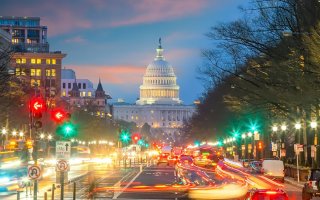 The Capitol Building lit up at night in Washington DC.