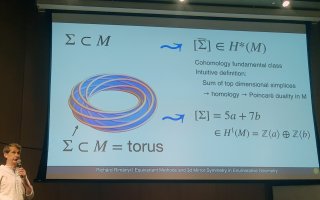 University of North Carolina Professor of Mathematics Richárd Rimányi presents his findings at the AMS Fall Meeting at the University at Albany on Oct. 19. (Photo by Cristian Lenart/UAlbany Mathematics)