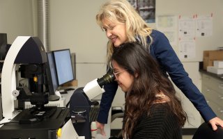 Nanobioscience PhD student Maria Belen Paredes-Espinosa, seated, with Associate Professor Janet Paluh, is one of four winners of the John J. Sullivan Professional Development Award this year.