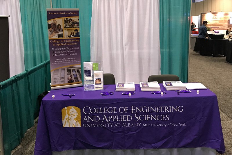 college of engineering and applied sciences table at an expo