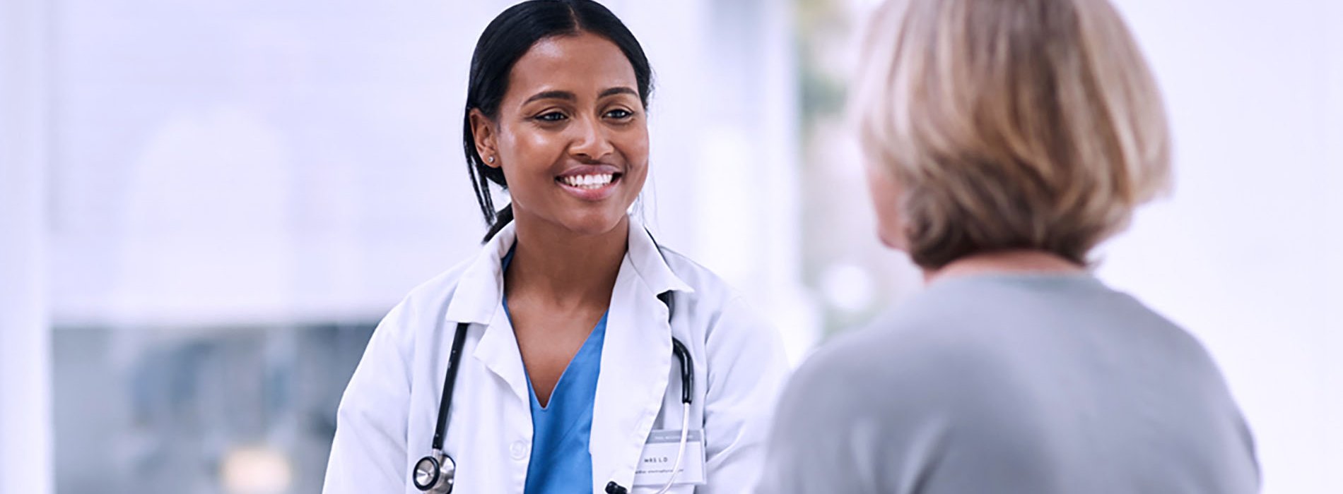 Nurse speaking with a patient.