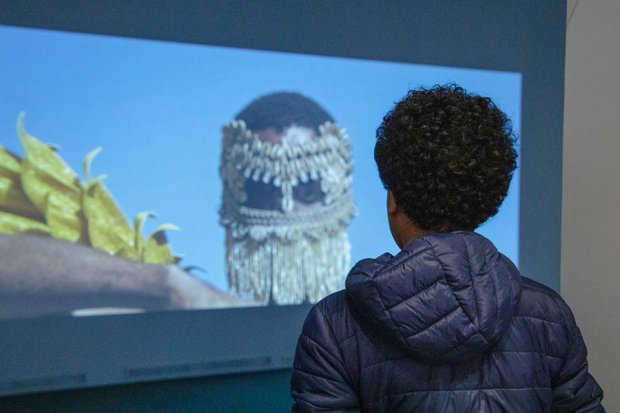 Student in front of a projection